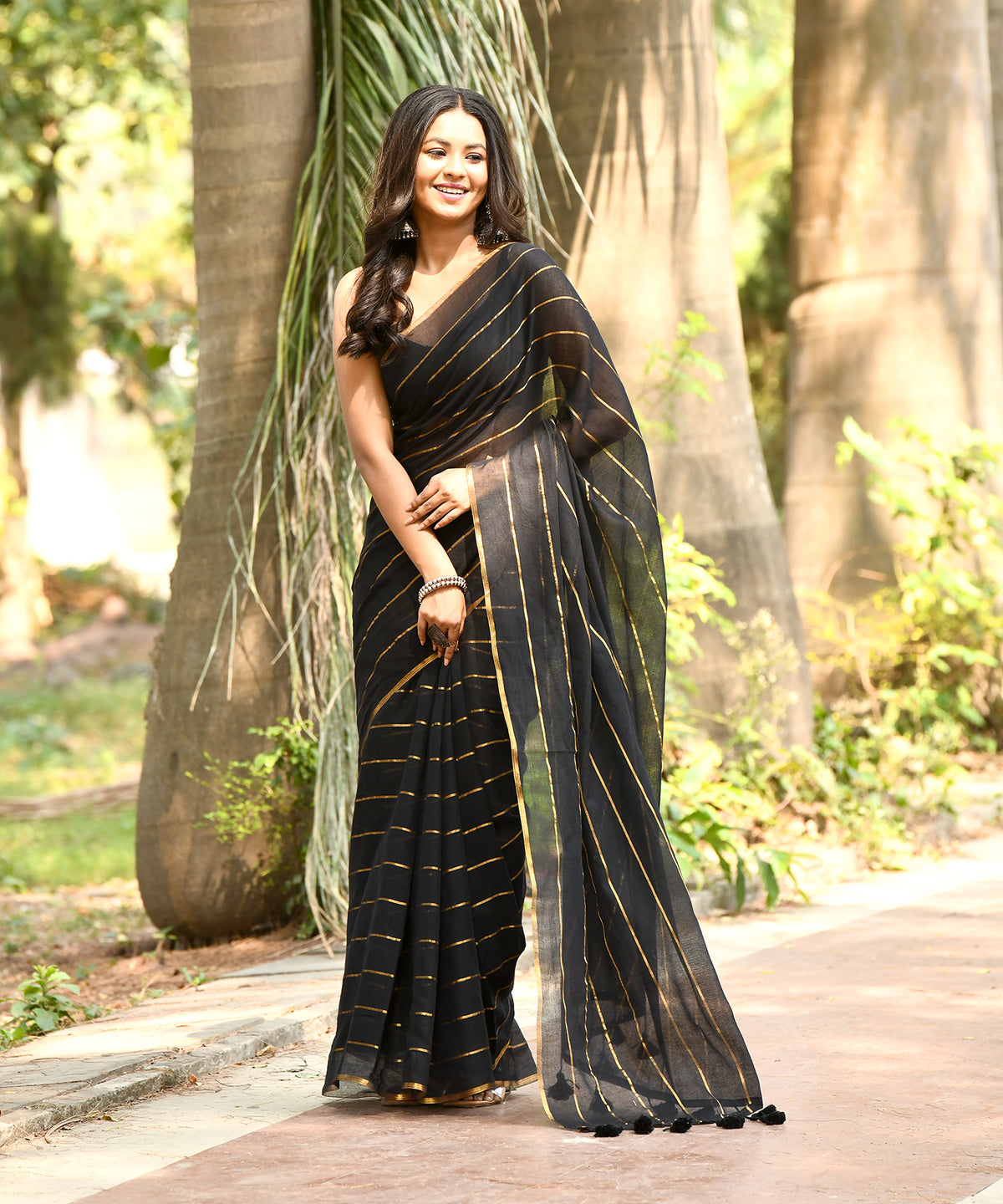 MIDNIGHT GLEAM SAREE  -  Pure cotton Black saree with golden stripes and tassels